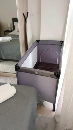 a bedroom with a bed with a dresser in a room at Katrin chios in Chios