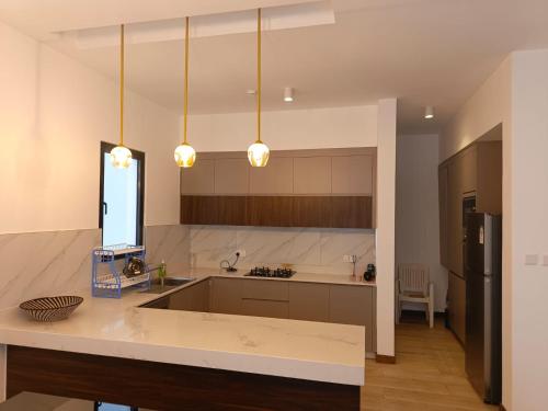 a large kitchen with a sink and a counter at Intercultural Apartment Nairobi Two Rivers in Nairobi