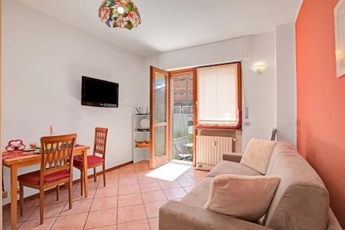 a living room with a couch and a table at Bardonest - Central Studio in Bardonecchia - Happy Rentals in Bardonecchia