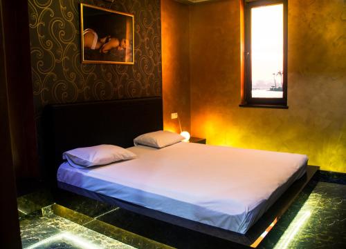 מיטה או מיטות בחדר ב-Mirage Hotel