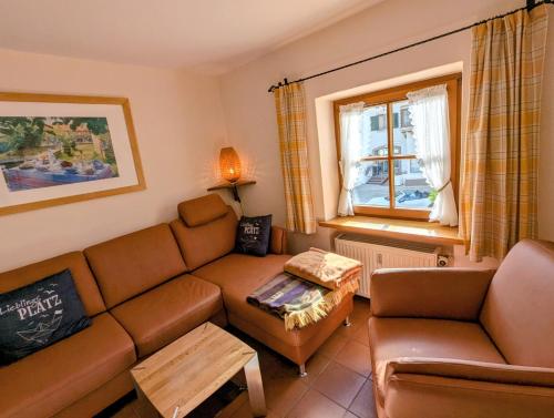a living room with a couch and a table at Ferienwohnung Jodlschmid in Ruhpolding