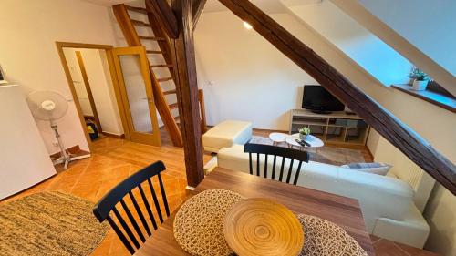 a living room with a couch and a table at Apartmány v Žitě in Třeboň