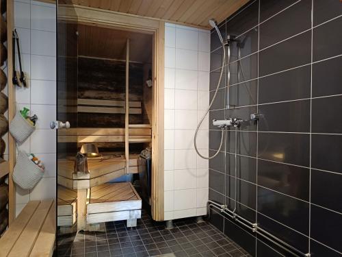 a bathroom with a shower and a sink at Ruska in Syöte