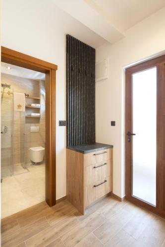 a bathroom with a sink and a bath tub at Villa President 3 in Krimovice