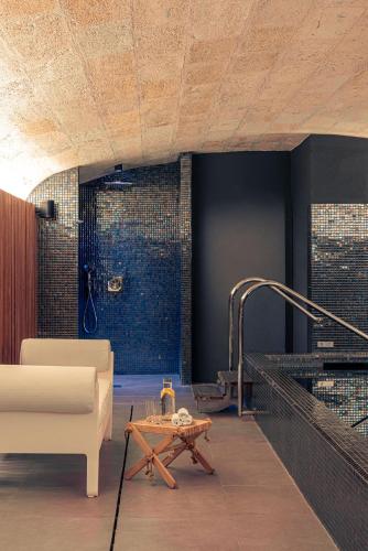 a living room with a couch and a table at Villas Foch Boutique Hotel & Spa Bordeaux in Bordeaux