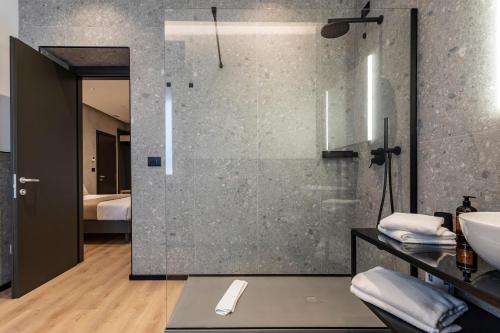 a bathroom with a shower and a sink at Corso 84 Luxury Suites in Pescara