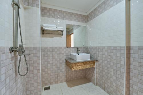 a bathroom with a sink and a shower at Summer Dream Hotel in Phú Quốc