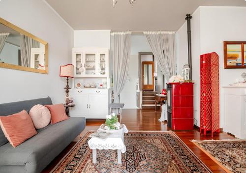 a living room with a couch and a table at B&B La Casa di Pamela - 5 min Lago Varese in Varese
