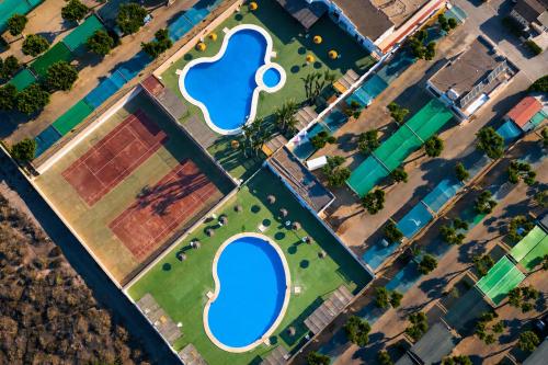 an overhead view of two swimming pools in a park at Kampaoh Roquetas in Roquetas de Mar