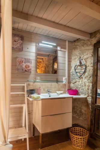 a bathroom with a sink and a mirror at L'echappée de la lozère in Les Laubies
