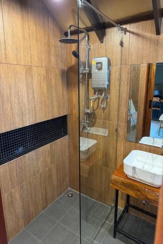 a bathroom with a shower and a sink at Pha Lae Tawan@Siray in Phuket
