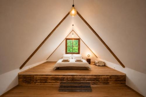 a bed in a room with a window at Frein Chalets - Kaltenbach 1A in Frein