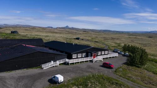 an overhead view of a black building in a field at Hotel Stafholt in Varmaland