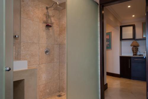 a bathroom with a shower with a glass door at Stella Road 24 in Ballito