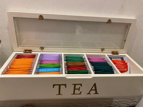 a drawer full ofcolored ties in a white box at Hotel Lobo de Mar in Mar del Plata