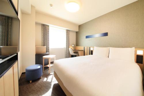 Letto o letti in una camera di Richmond Hotel Tokyo Suidobashi