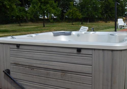 a bath tub sitting on top of a building at Bohemica Apartman 4 in Kouřim
