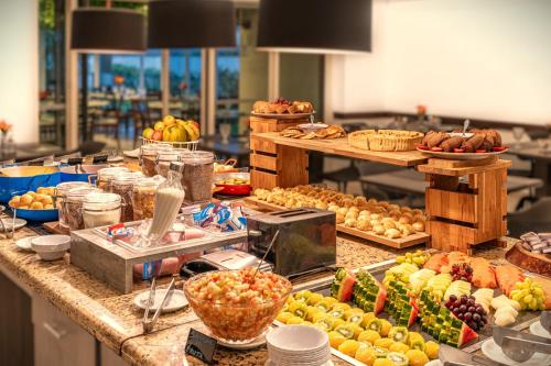 a buffet line with many different fruits and vegetables at Intercity Interative São Paulo Jardins in São Paulo