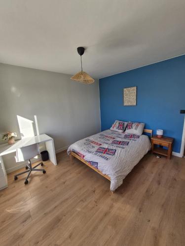 a bedroom with a bed and a desk and a bed sidx sidx sidx at La Verdière in Barjols