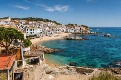 a view of a beach in a coastal town at Kampaoh Calella de Palafrugell in Calella de Palafrugell