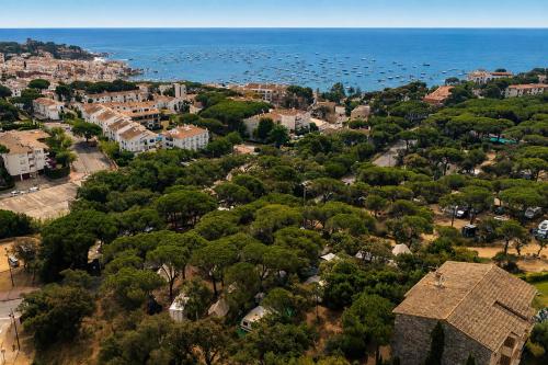 an aerial view of a city and the ocean at Kampaoh Calella de Palafrugell in Calella de Palafrugell