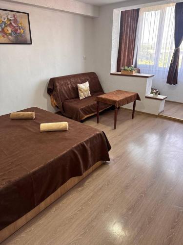 a living room with two beds and a couch at Very good location in Hunedoara