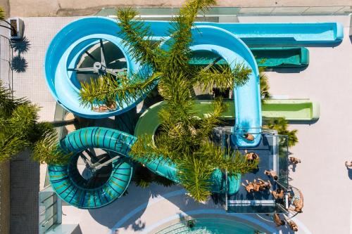 a merry go round with a christmas tree on it at Kampaoh Bayona Playa in Baiona