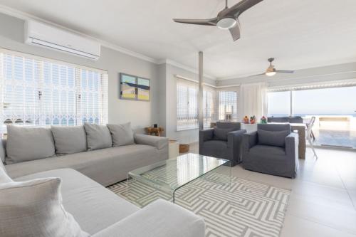 a living room with a couch and a table at Vallen Lodge 2 in Ballito