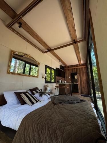 a bedroom with two beds in a room at Lakajų Resort in Molėtai