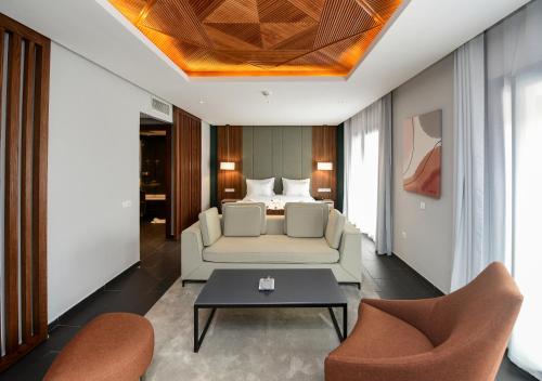 a living room with a couch and a bed at ZEPHYR Ifrane in Ifrane