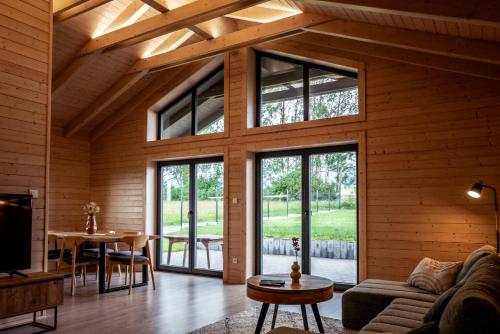 a living room with a couch and a table at Zrub Lipa, Tatry, krb a súkromie in Mengusovce