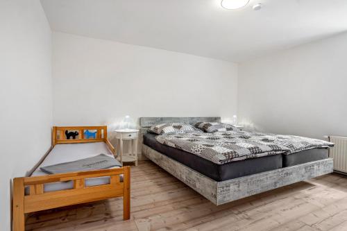 a bedroom with two beds and a table at Ferienwohnung bis zu 6 Per. 65 M² in Wolgast