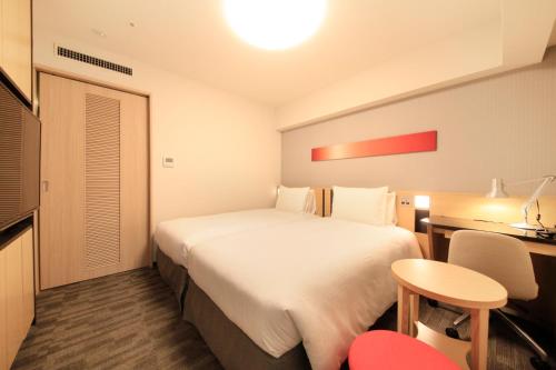 Letto o letti in una camera di Richmond Hotel Tokyo Suidobashi