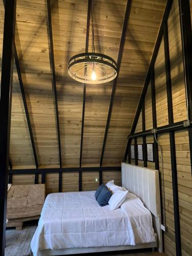 Giường trong phòng chung tại Chalet Renacer