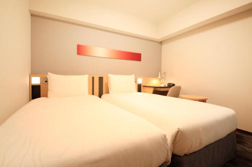 Letto o letti in una camera di Richmond Hotel Tokyo Suidobashi