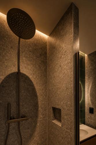 a bathroom with a shower with at 23 Boutique Hotel in Il-Furjana
