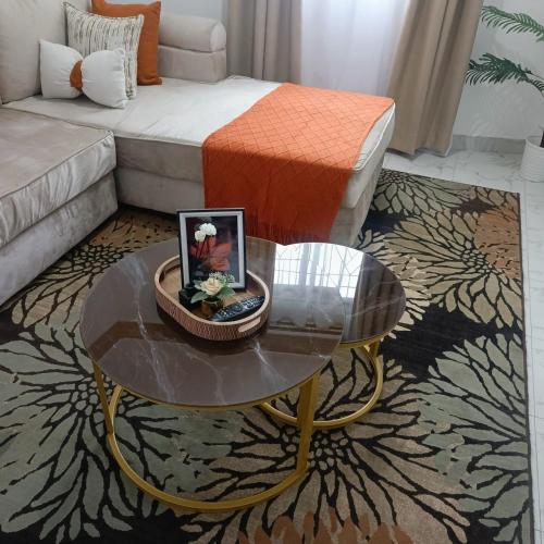 a living room with a coffee table and a couch at MahaliaLuxuryStays in Malindi