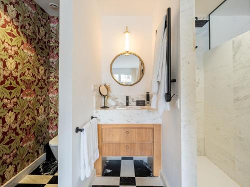 a bathroom with a sink and a mirror at Hotel Boutique San Diego - Adults Only in Las Lagunas