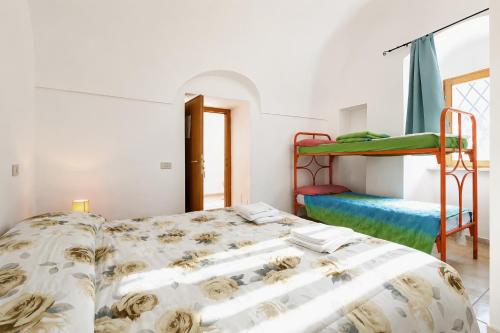 a bedroom with two bunk beds in it at Casa Natura Gargano in Monte SantʼAngelo