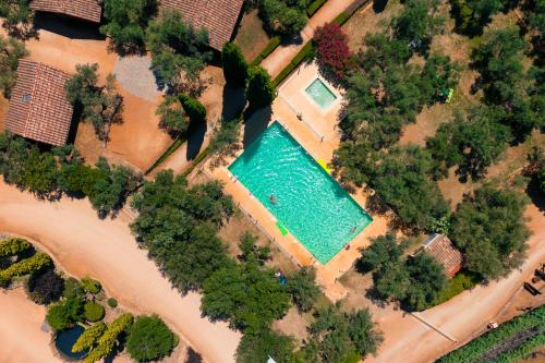 an aerial view of a swimming pool in a park at Kampaoh Alquézar in Alquézar