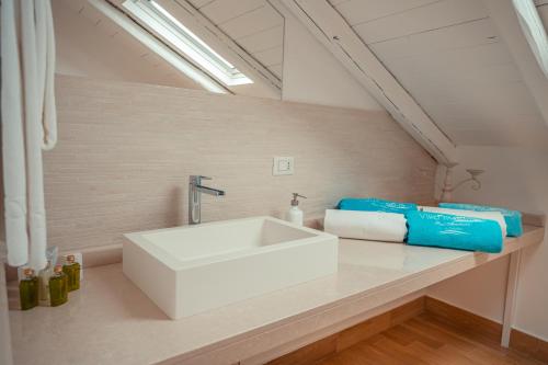 a bathroom with a white sink on a counter at Villa Mastrissa Taormina - Private Villa with 2 pool in Taormina