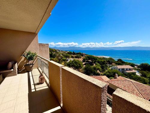 a balcony with a view of the ocean at Casamea - Terrasse Mer, Plage 5min, Barbicaja in Ajaccio