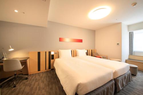 Letto o letti in una camera di Richmond Hotel Tokyo Suidobashi