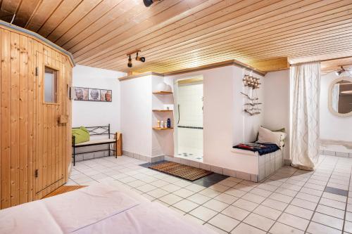a large room with a bed and a window at Weibhauser Franzl in Ruhpolding