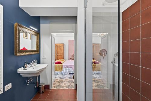 a bathroom with a sink and a shower at Podere il Cavallo Blu in Le Focette