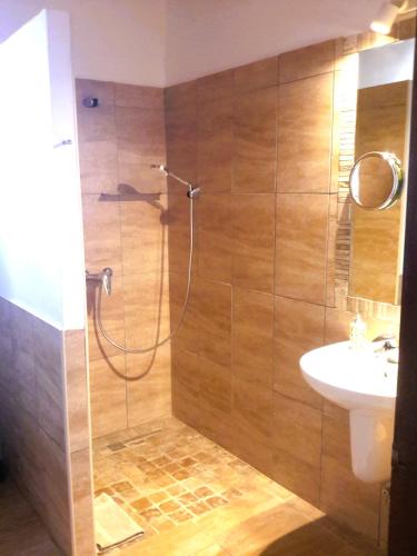 a bathroom with a shower and a sink at Finca Alqueria Fosca in Campos