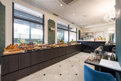 a buffet line with a lot of food on display at Hotel Eden in Budva