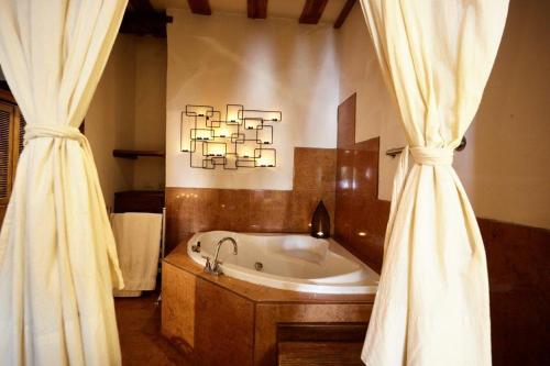 Kylpyhuone majoituspaikassa Hotel Quinta Mision