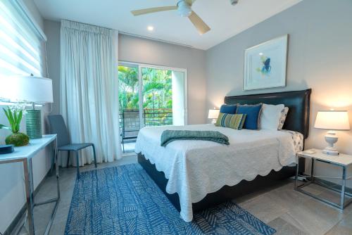 a bedroom with a large bed and a window at Elan at Ballena Beach in Uvita