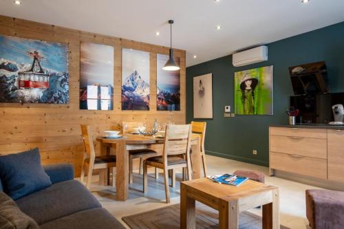 a living room with a table and a dining room at APPENNINS Annecy Rent Lodge in Annecy
